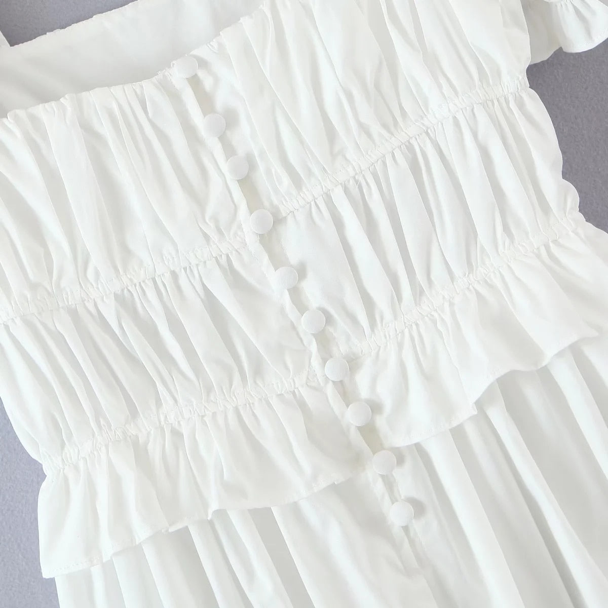 white cotton ruffle dress